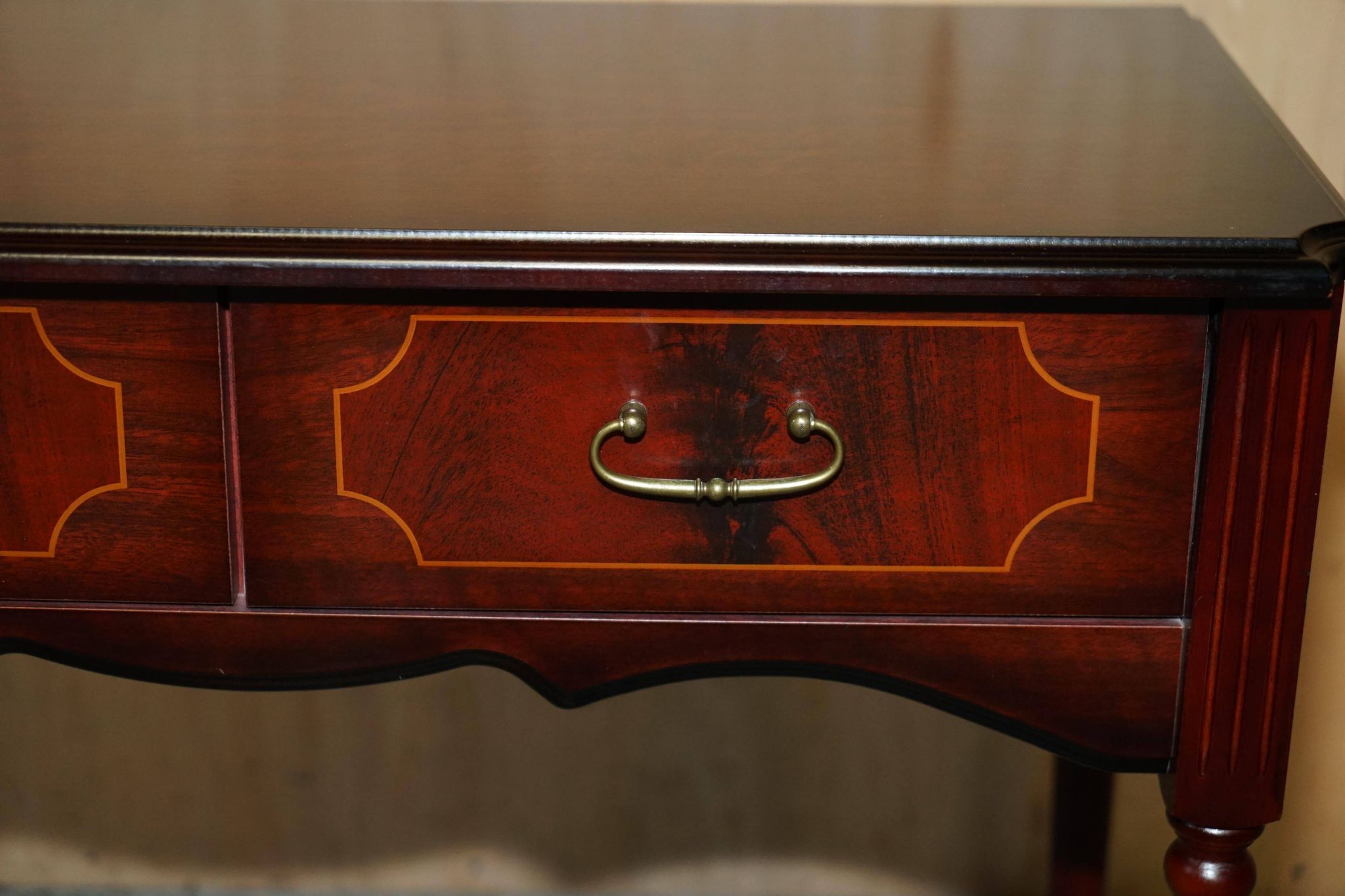 Small console with two drawers in hardwood finish.