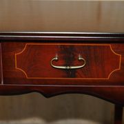Small console with two drawers in hardwood finish.