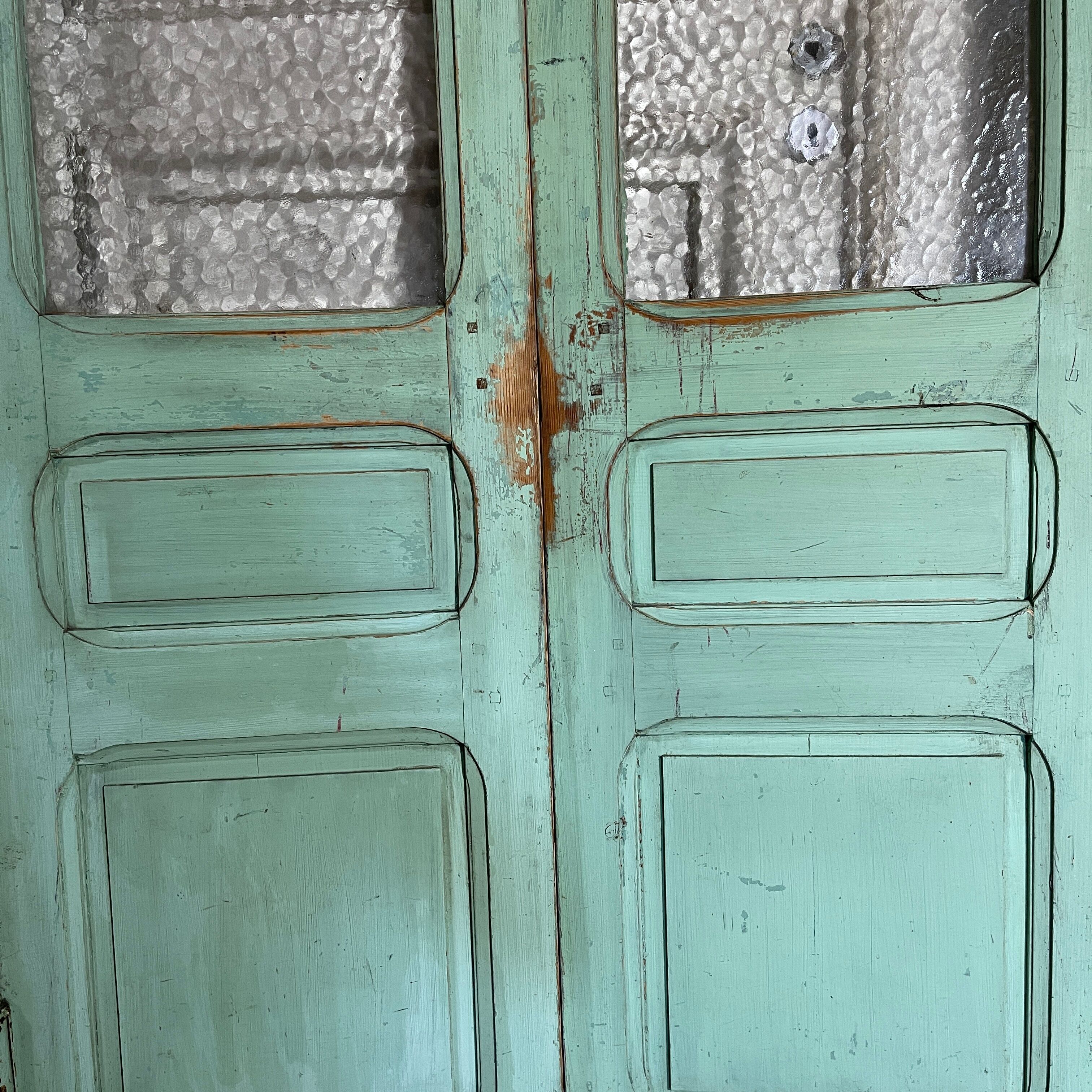 Old pair of saloon type glass doors