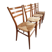 Set of 4 mid-century Italian dining chairs with woven seats, circa 1950–1970.
