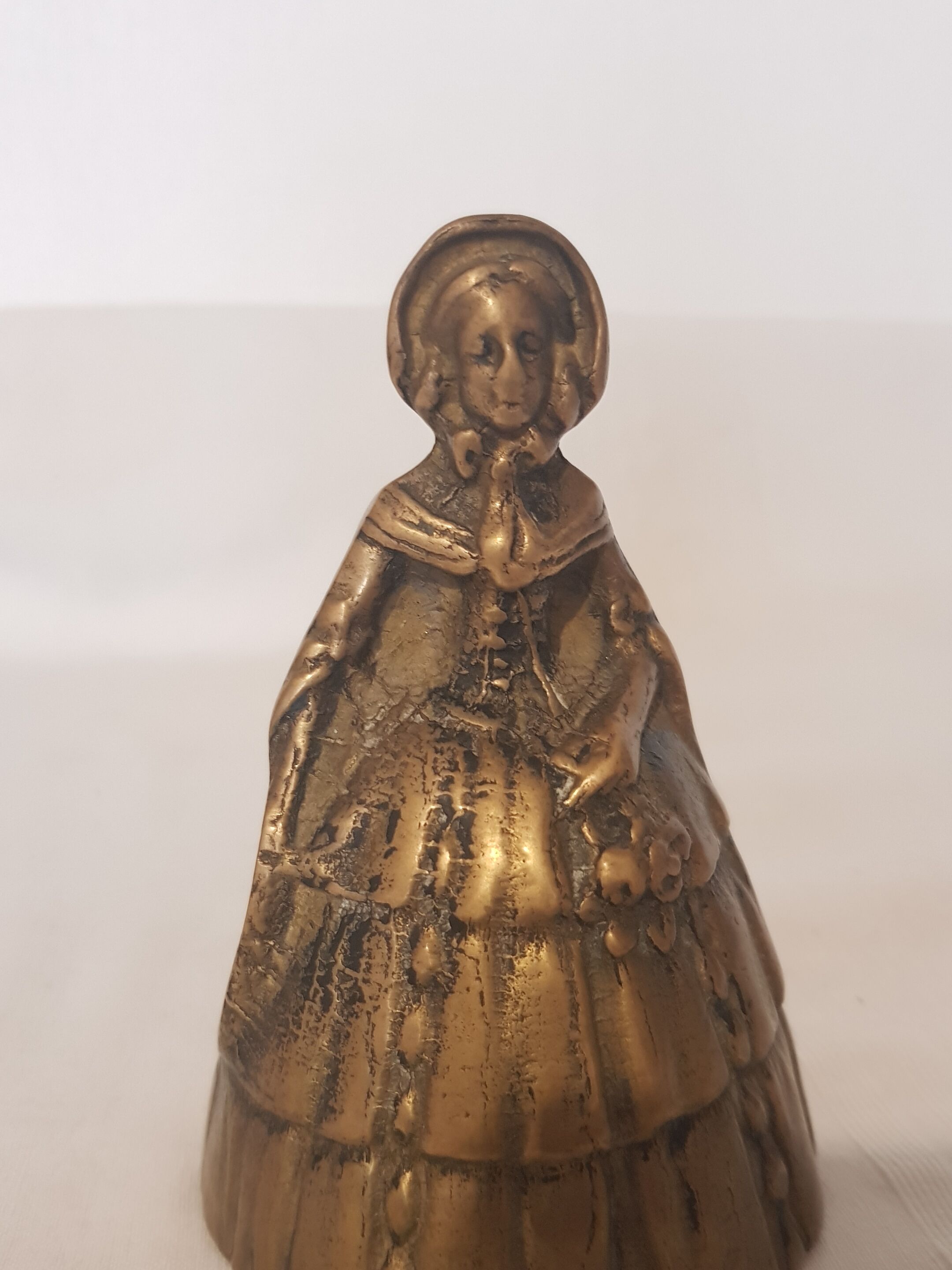 Women's bronze table bell