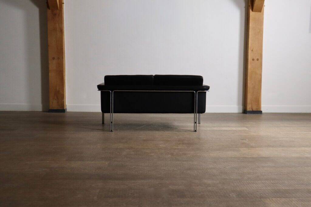 Horst Brüning Model 6912 two seater sofa in black leather for Kill International, Germany 1967