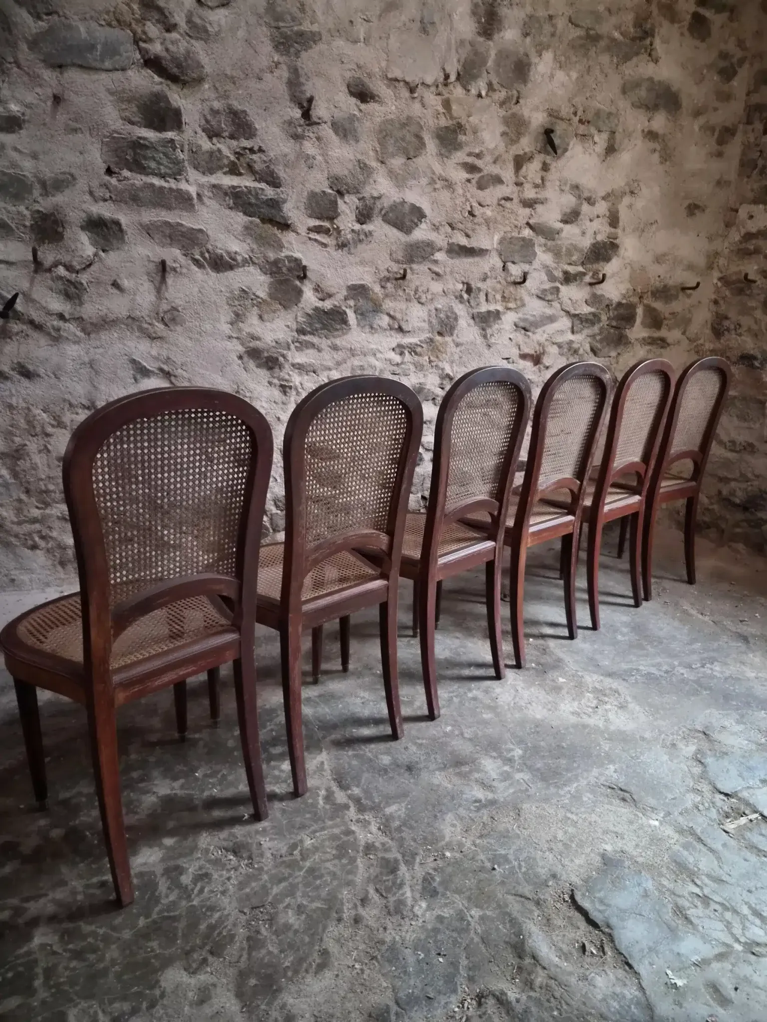 Set of 6 antique Louis XVI style dining chairs with caning.