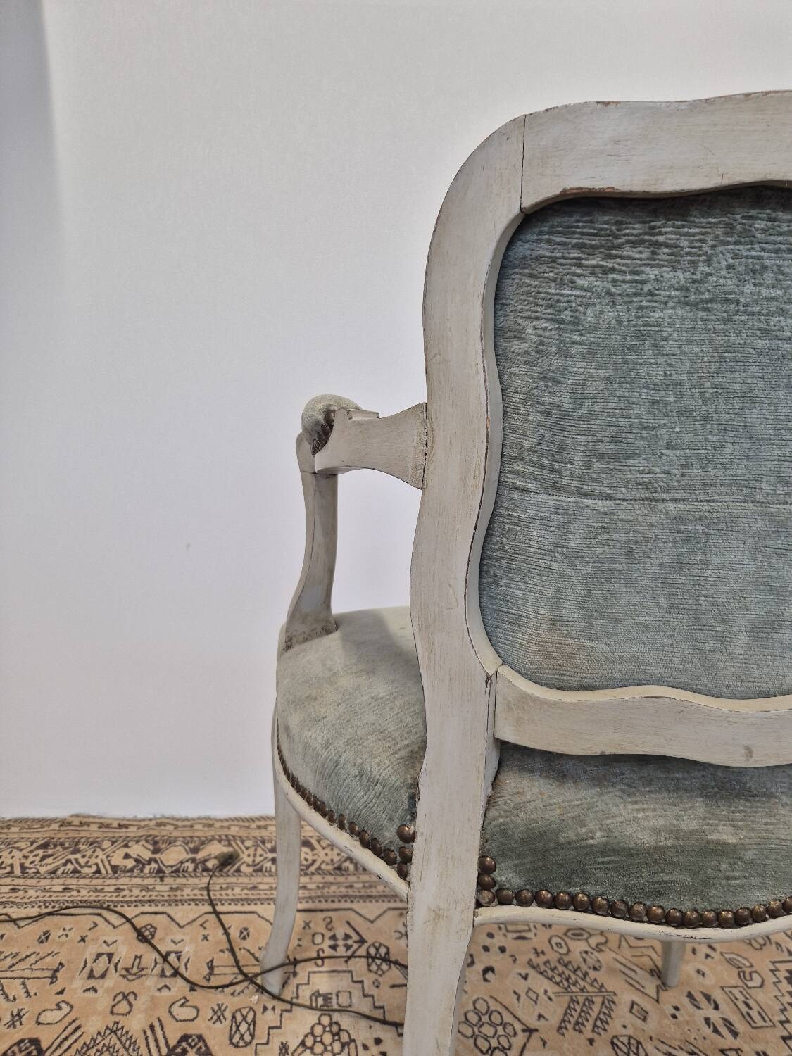 Louis XV style cabriolet armchair in patinated wood and velvet