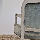 Louis XV style cabriolet armchair in patinated wood and velvet