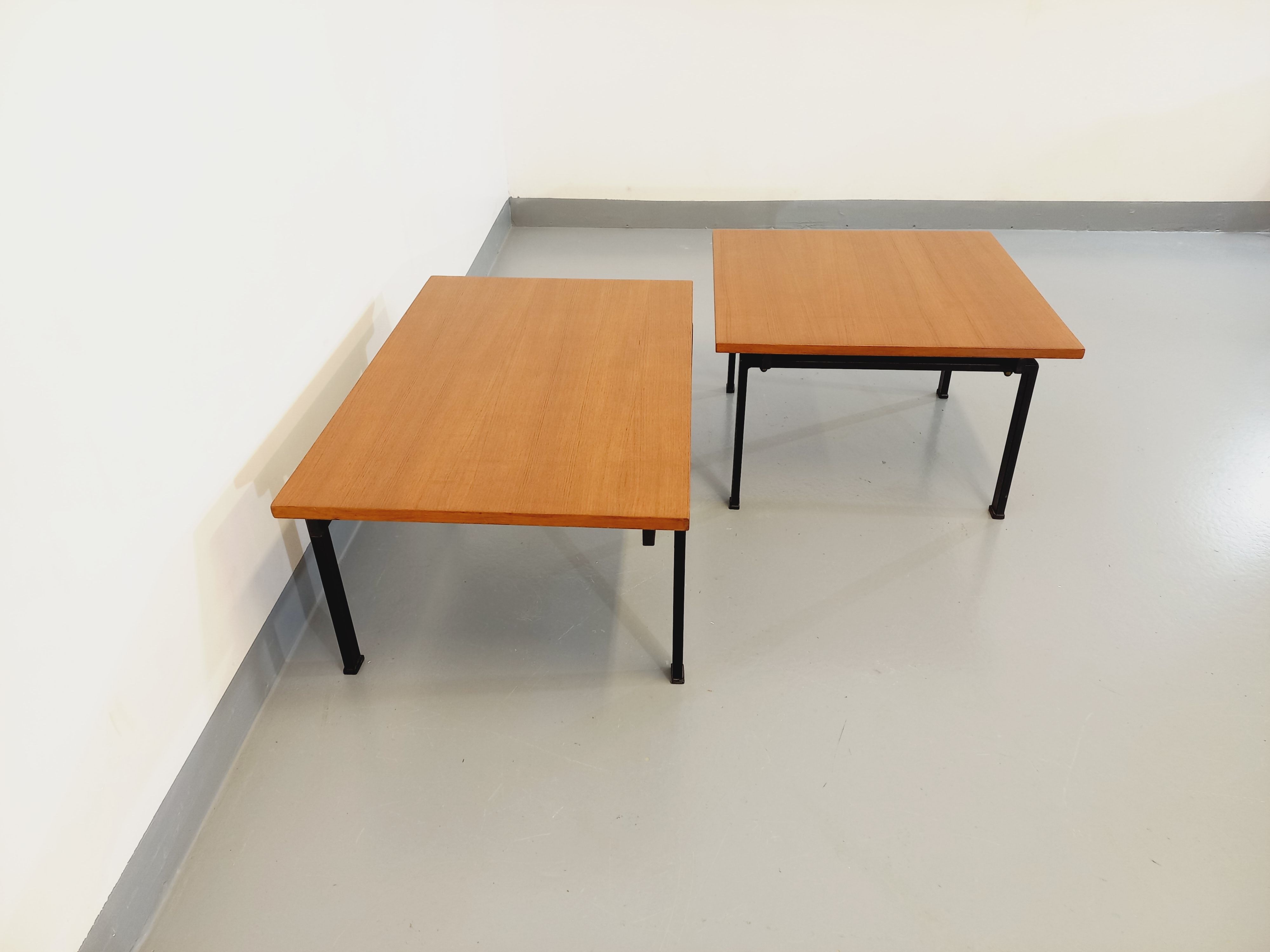 Suite of two vintage modernist Isa coffee tables in teak and black metal from the 60s