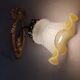 Antique wall light in gilded brass and glass tulip