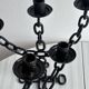 Paire de chandeliers anciens en métal noir