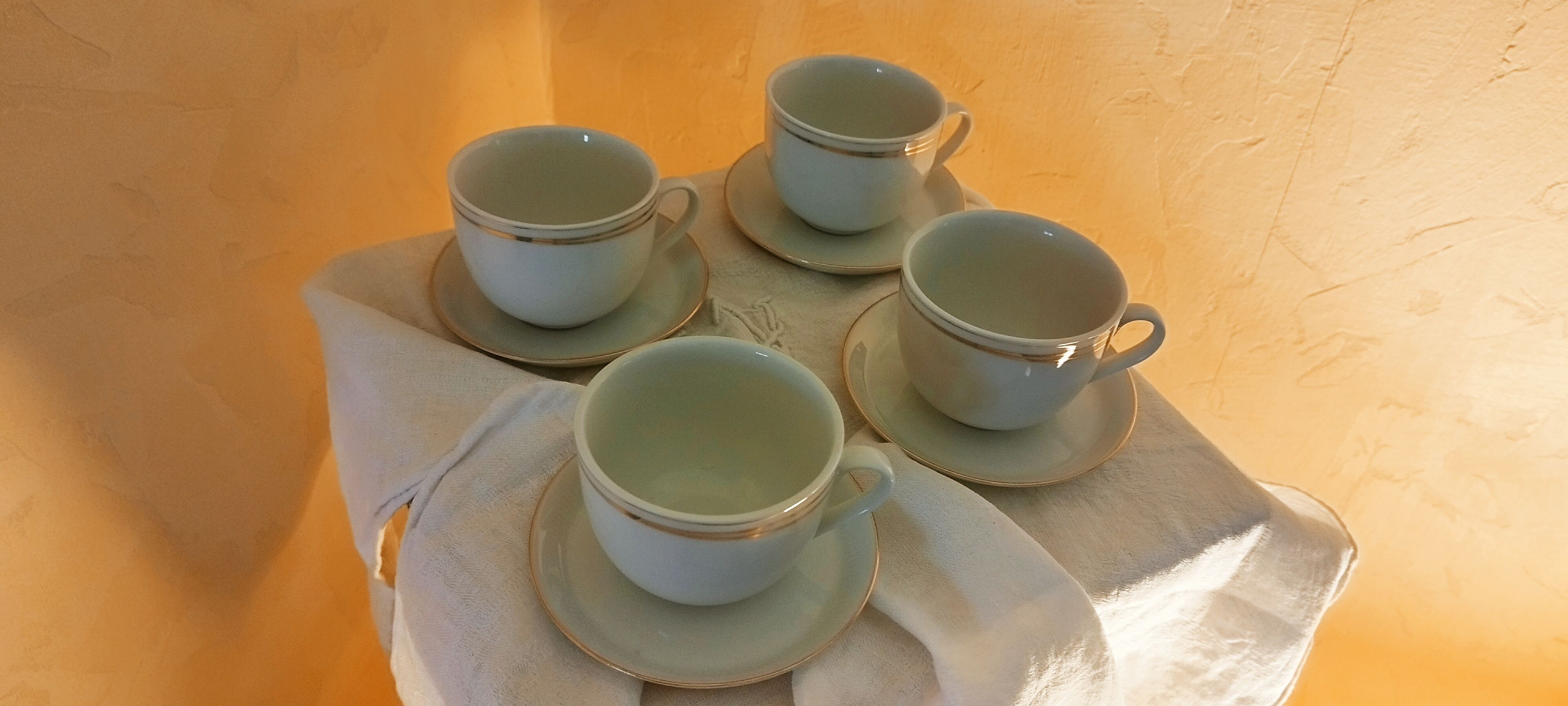 Set of 4 white and gold porcelain cups