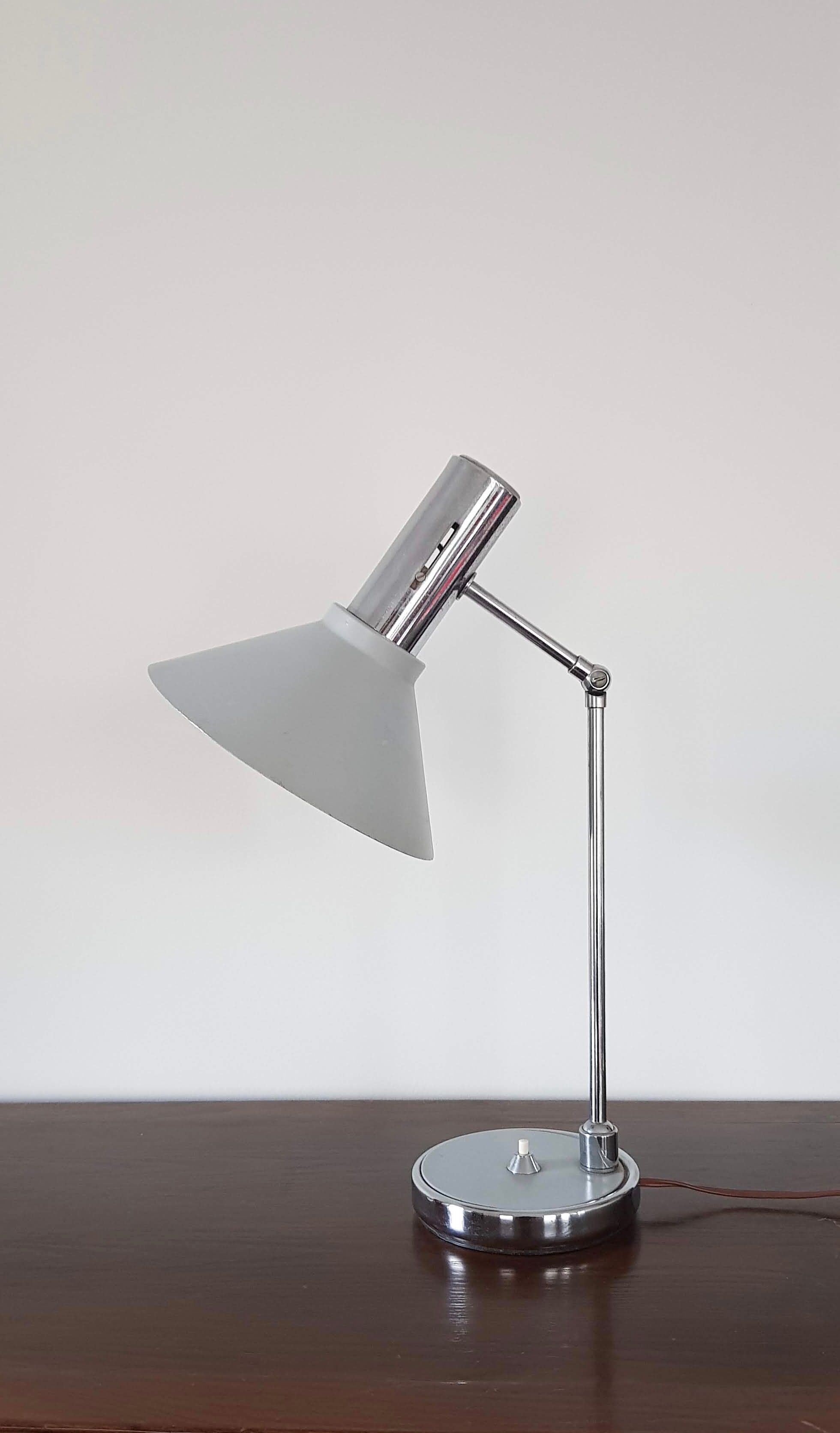 Chrome metal desk lamp and gray articulated arm