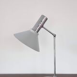 Chrome metal desk lamp and gray articulated arm