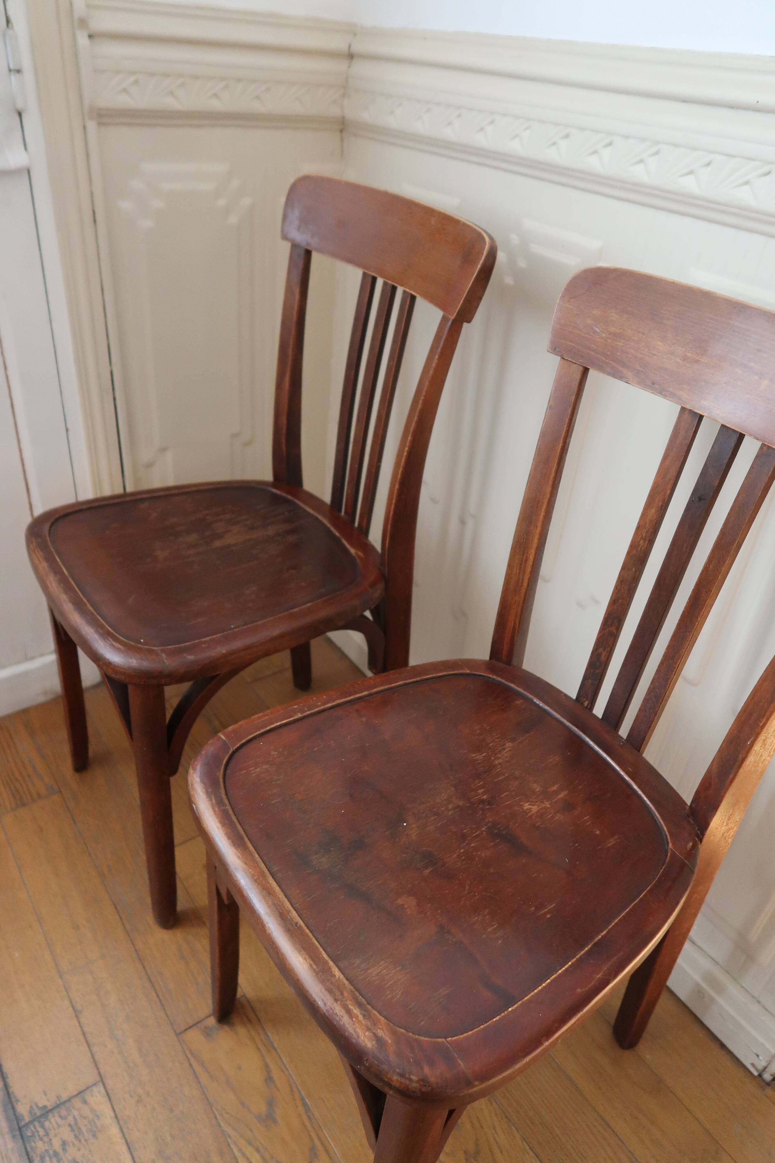 Pair of patinated bistro chairs
