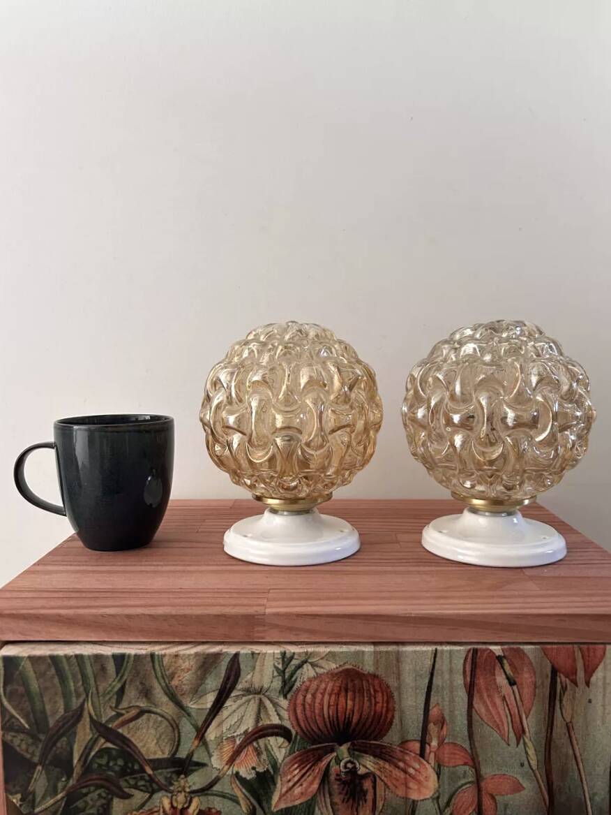 Pair of gold glass globe wall lights