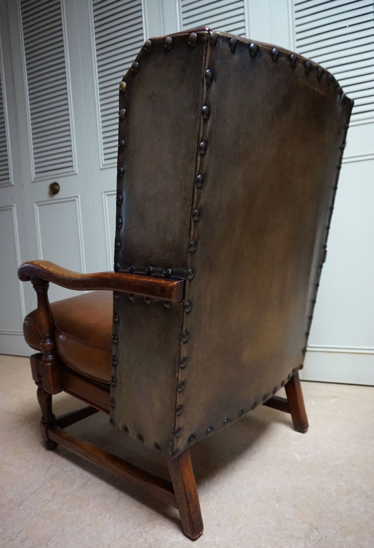 English high back cognac leather wingchair by Criterion cord