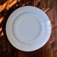 Large round dish from around 1870 signed Longwy with birds in sepia ironstone.