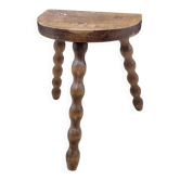 Tabouret tripode demi rond pieds boules