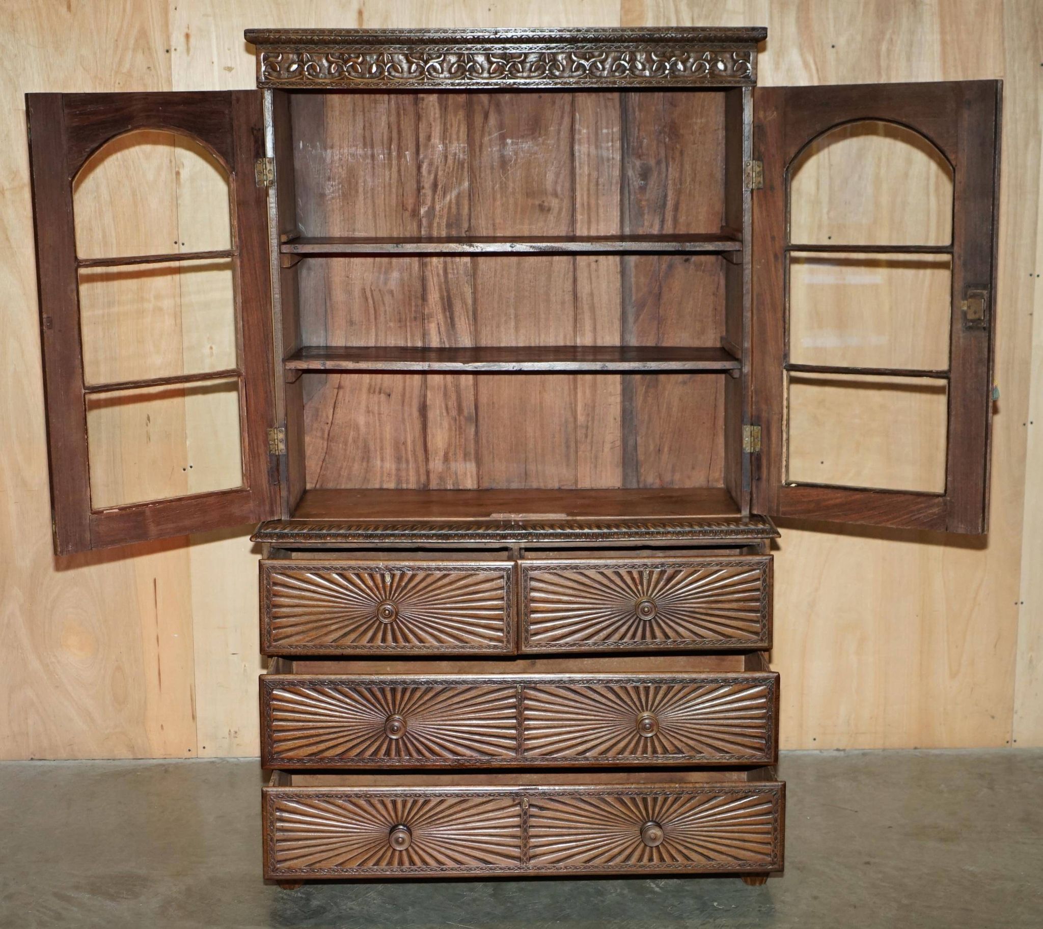 19th-century Anglo-Indian colonial hardwood library on a chest of drawers.