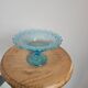 Plate on blue glass pedestal