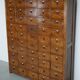 Large dutch oak apothecary cabinet / barber cabinet with enamel shields, 1900s