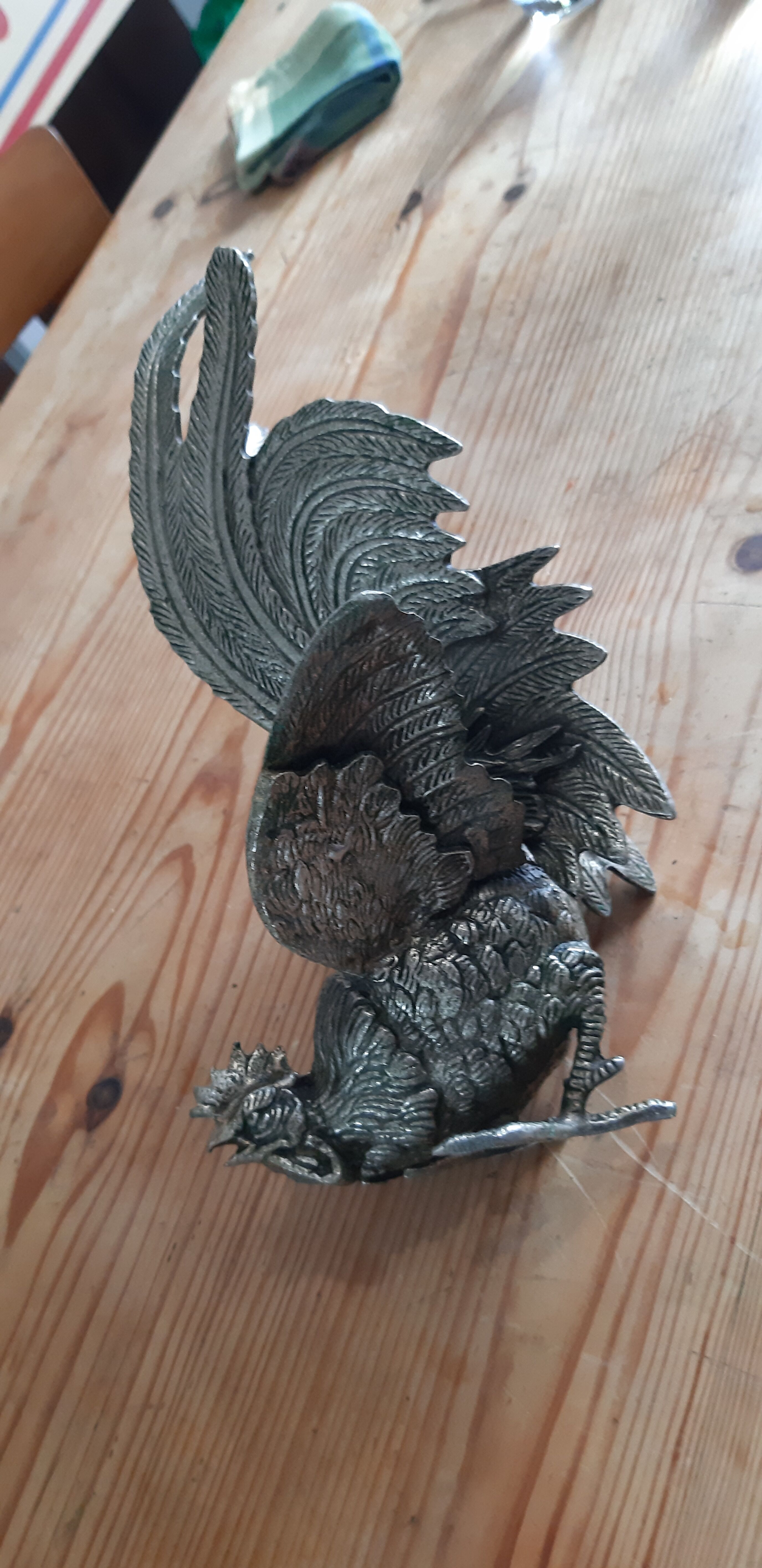 2 silver metal roosters