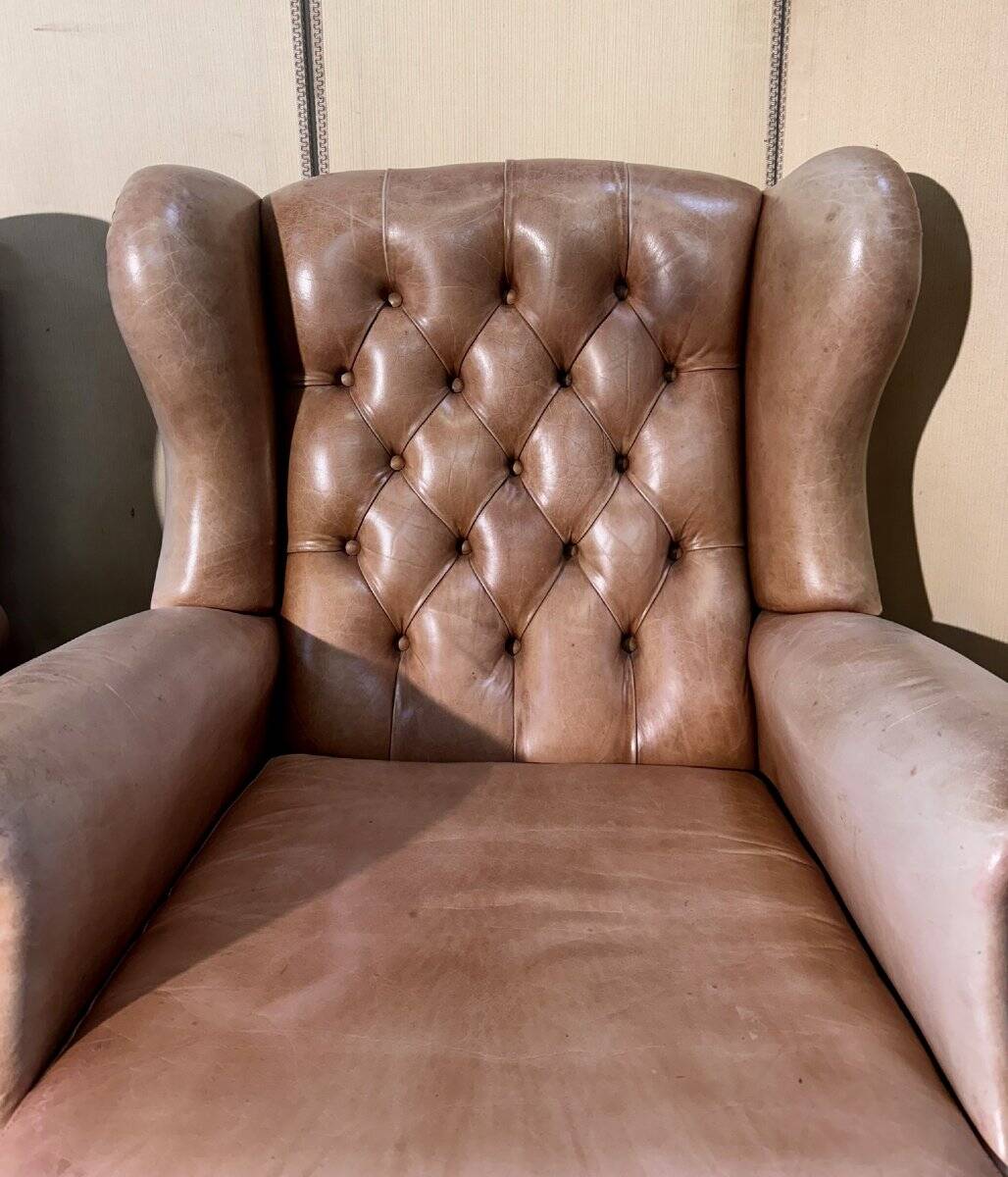 Pair of Chesterfield leather wingback armchairs