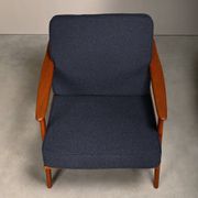 Pair Scandinavian Modern armchairs in teak and dark blue bouclé fabric