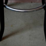 Pair of 1960s bistro bar stools in black and chrome with vinyl shell.