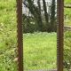Rustic mirror called brutalist, molded carved natural wood