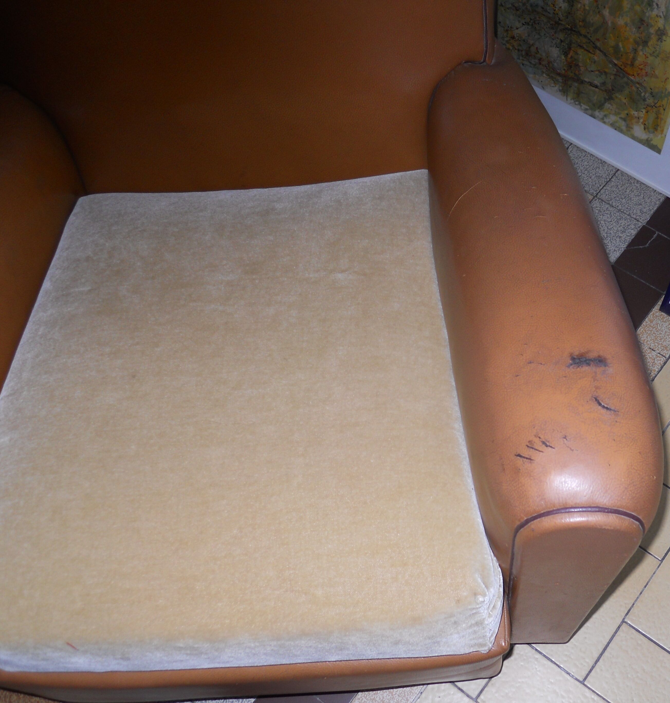 Brown leather club armchair