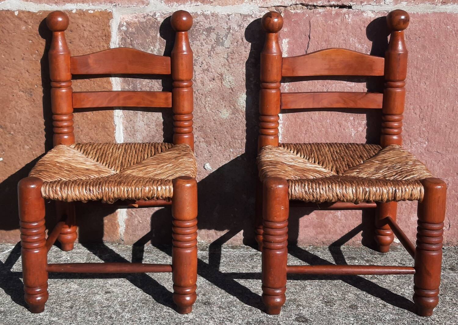 Pair of low armchairs by the fireplace. (Straw seat)