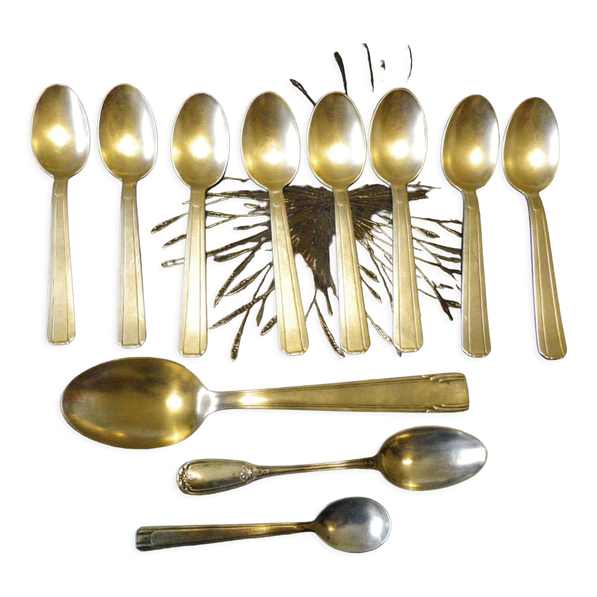 11 silver spoons with punches