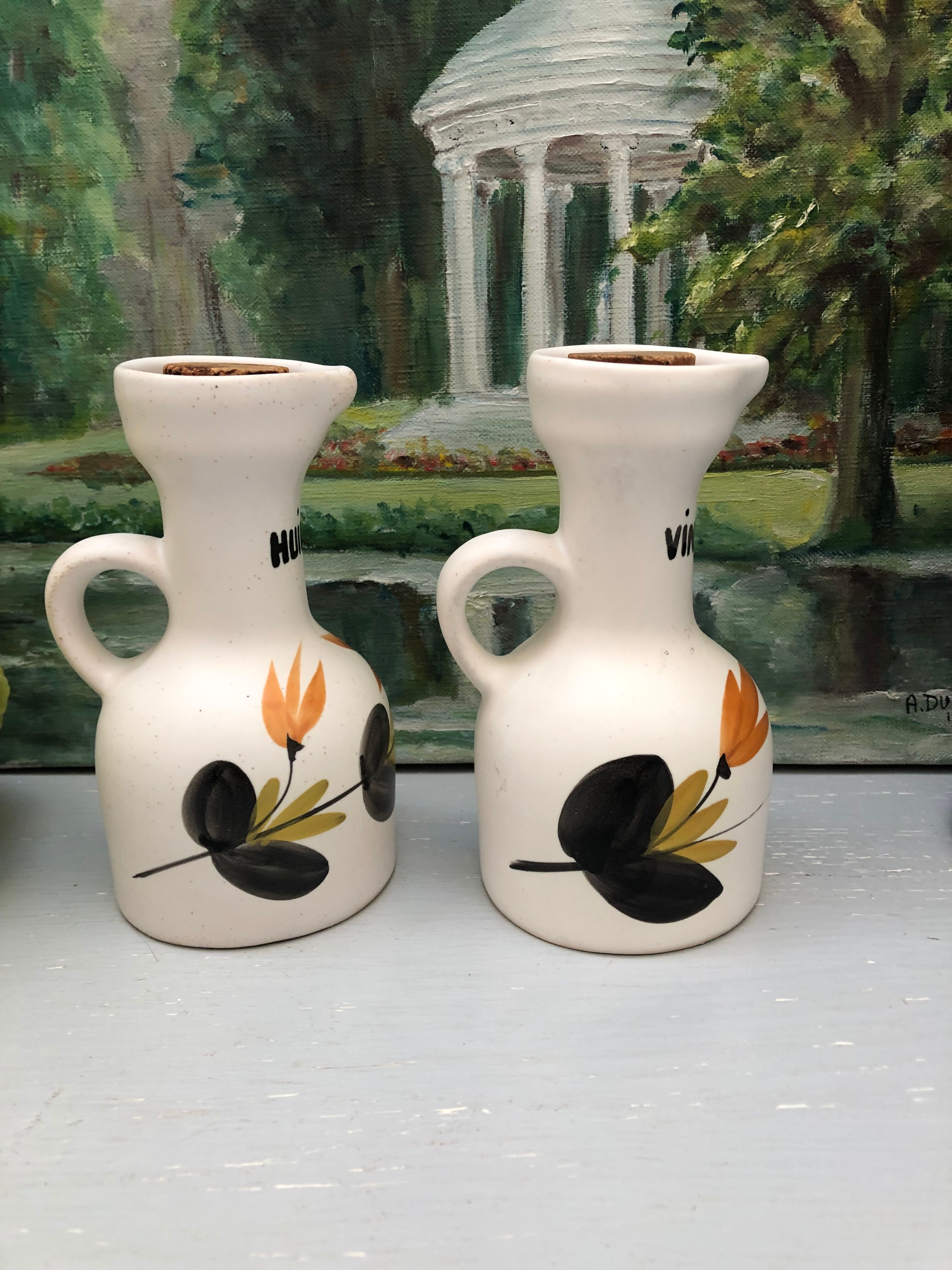 Old vinegar and oil maker with vintage decoration floral motifs