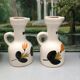 Old vinegar and oil maker with vintage decoration floral motifs