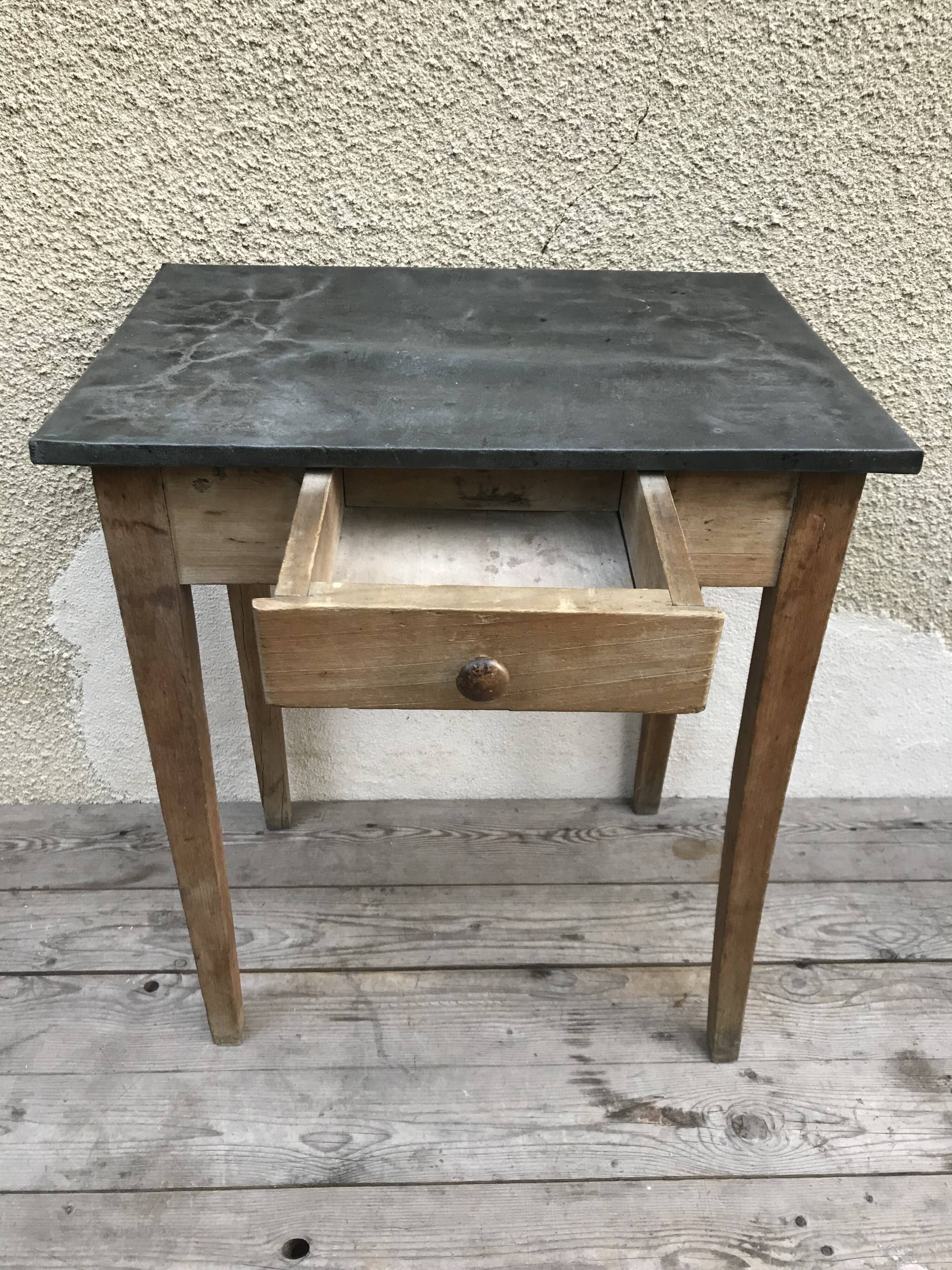 Old kitchen table in wood with compass feet