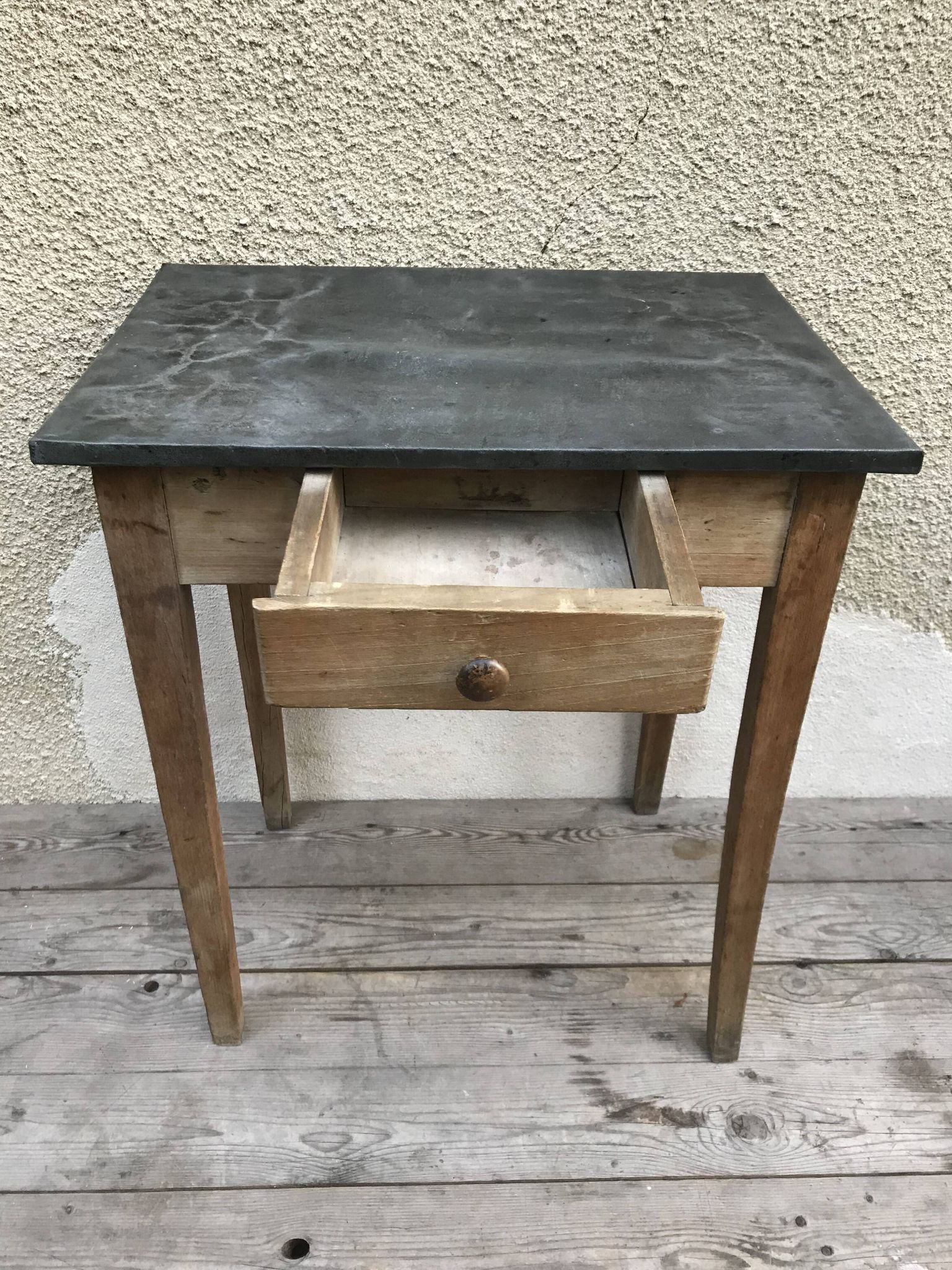 Old kitchen table in wood with compass feet