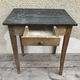 Old kitchen table in wood with compass feet
