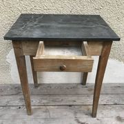 Old kitchen table in wood with compass feet