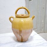 Old gargoulette pot in glazed terracotta