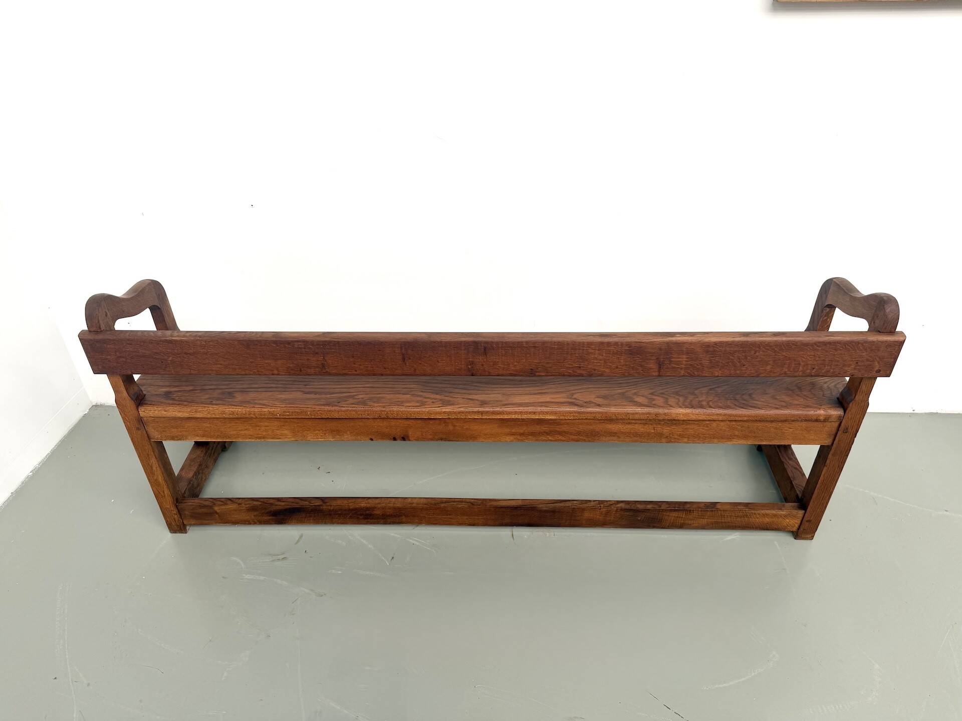 Pair of communal benches in solid oak, 1950s.