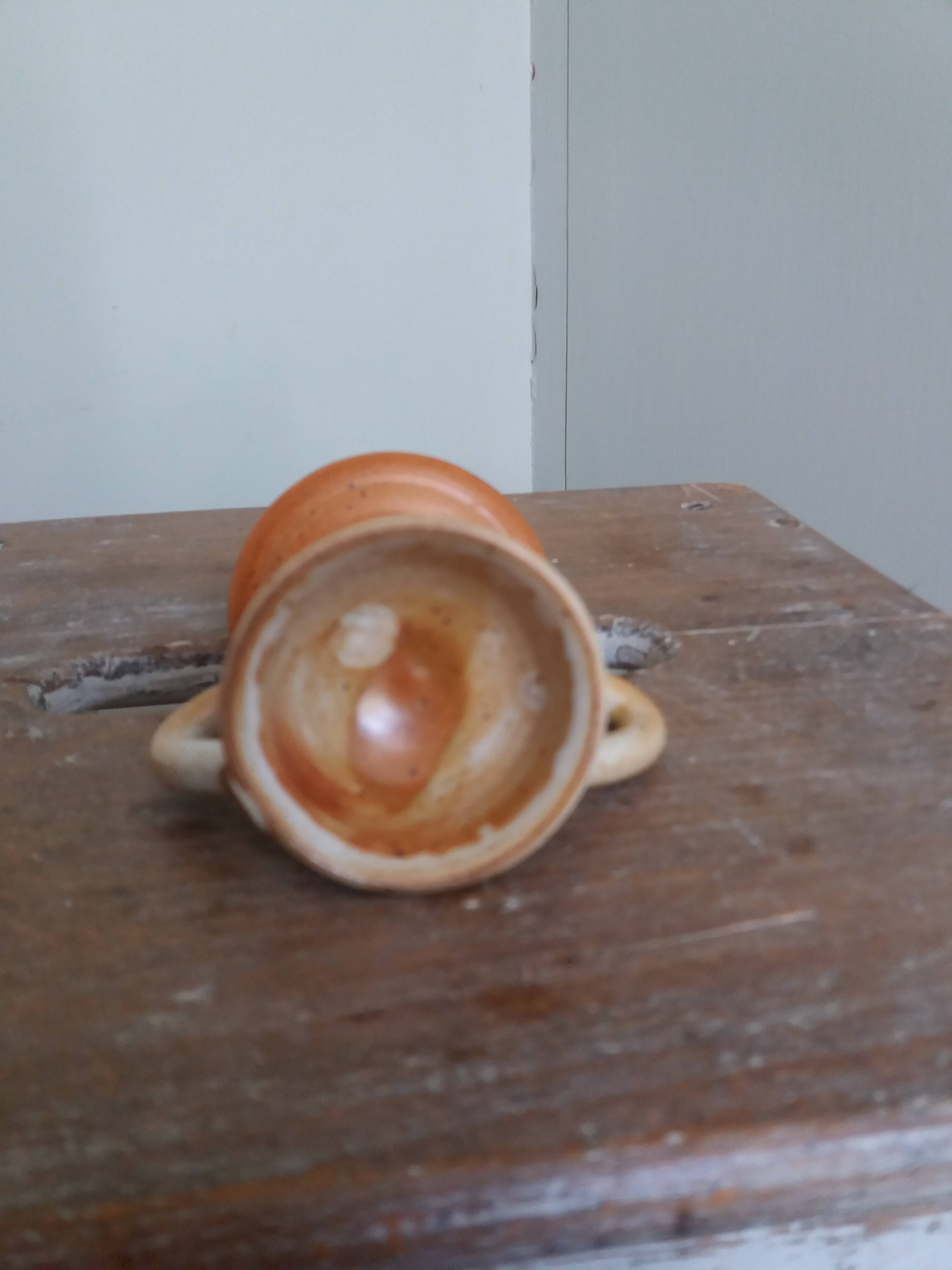 Anthropomorphic sandstone egg cup signed GL