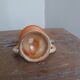 Anthropomorphic sandstone egg cup signed GL
