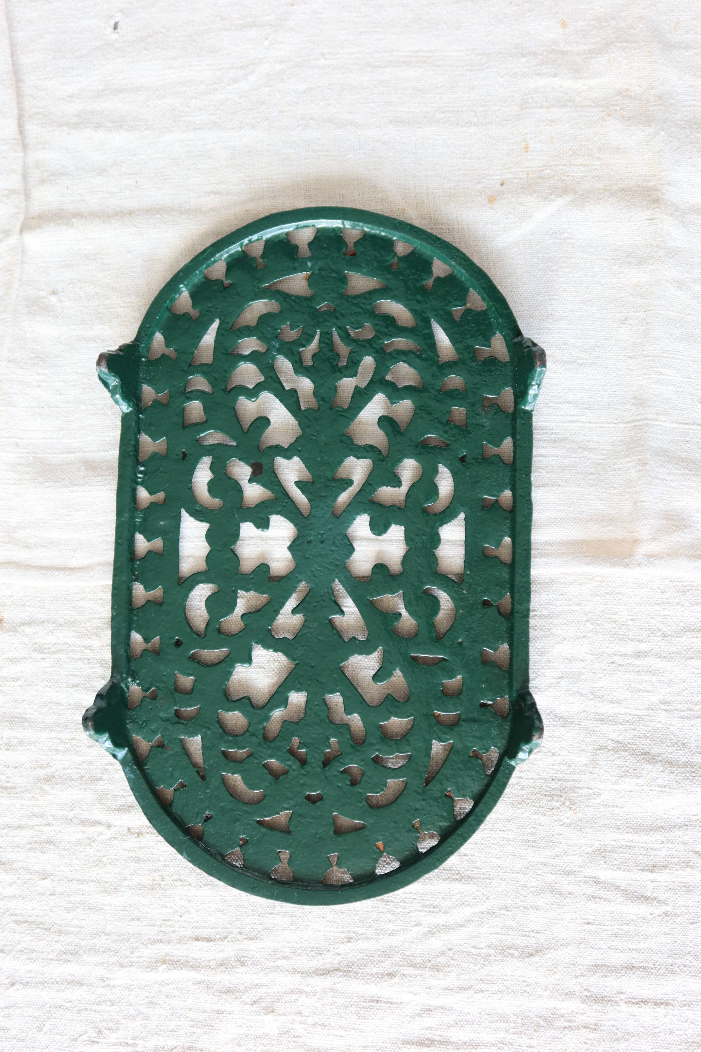 Vintage dark green cast iron oval trivet - Openwork design
