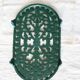 Vintage dark green cast iron oval trivet - Openwork design