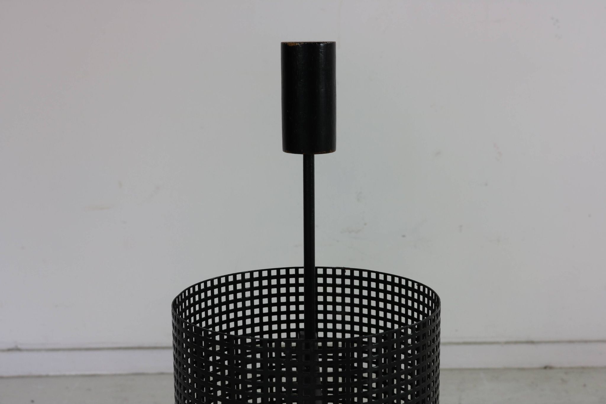 Minimalistic dutch design perforated metal umbrella stand