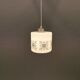 Scandinavian hanging lamp in white glass with inlayed black motifs.