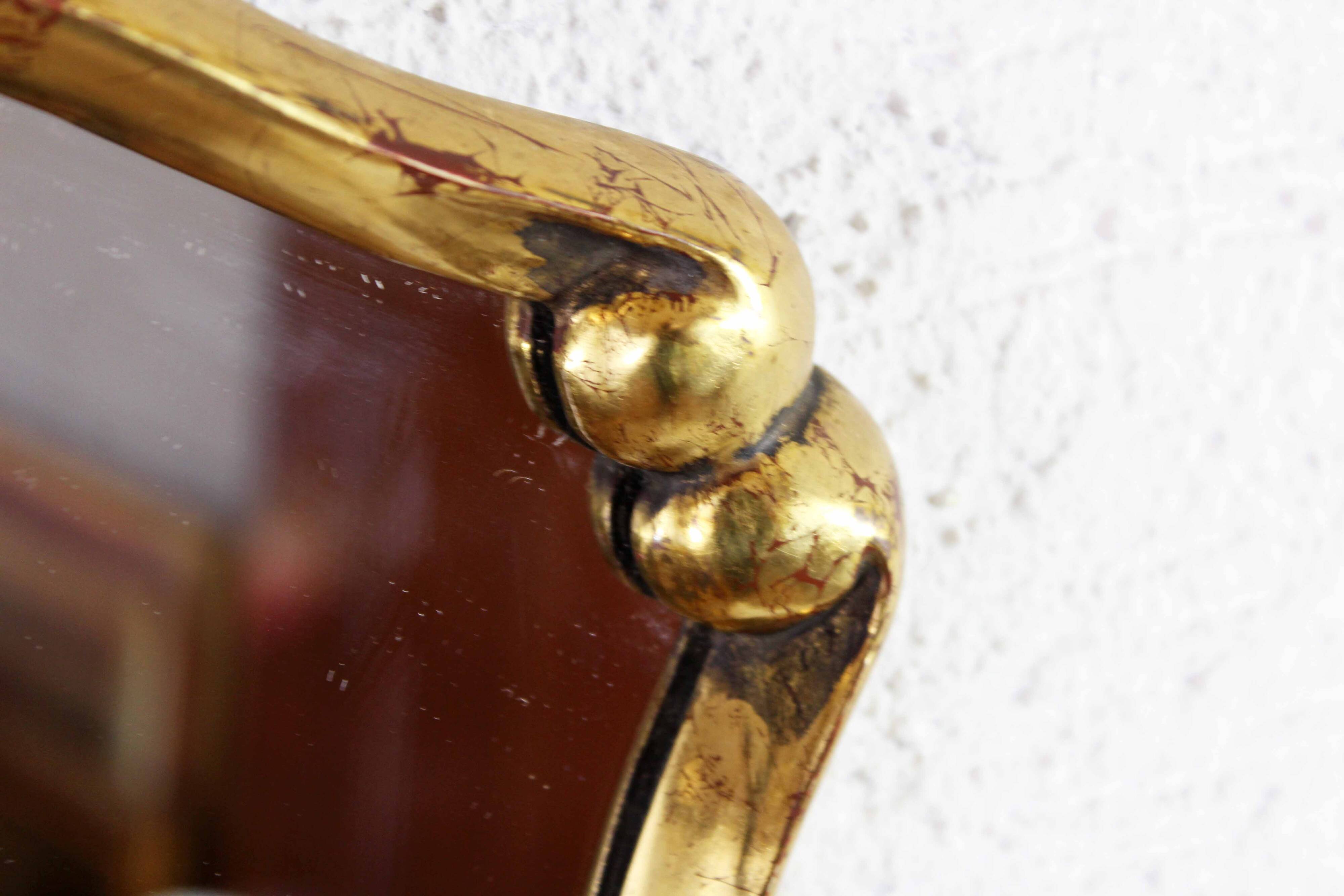 Mirror in gilded wood with leaf