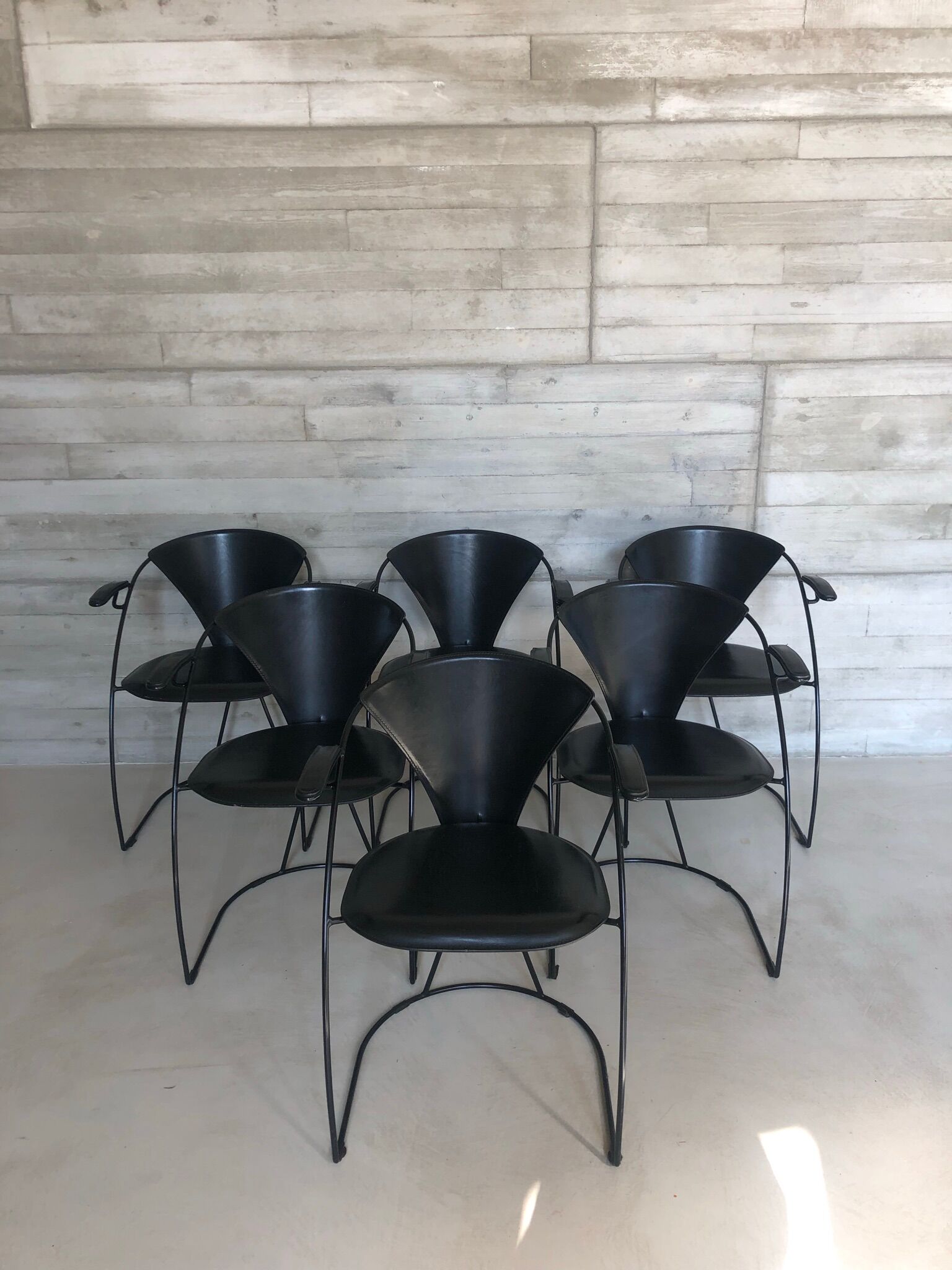 “Armlinda” black leather dining chairs by Arrben Italy