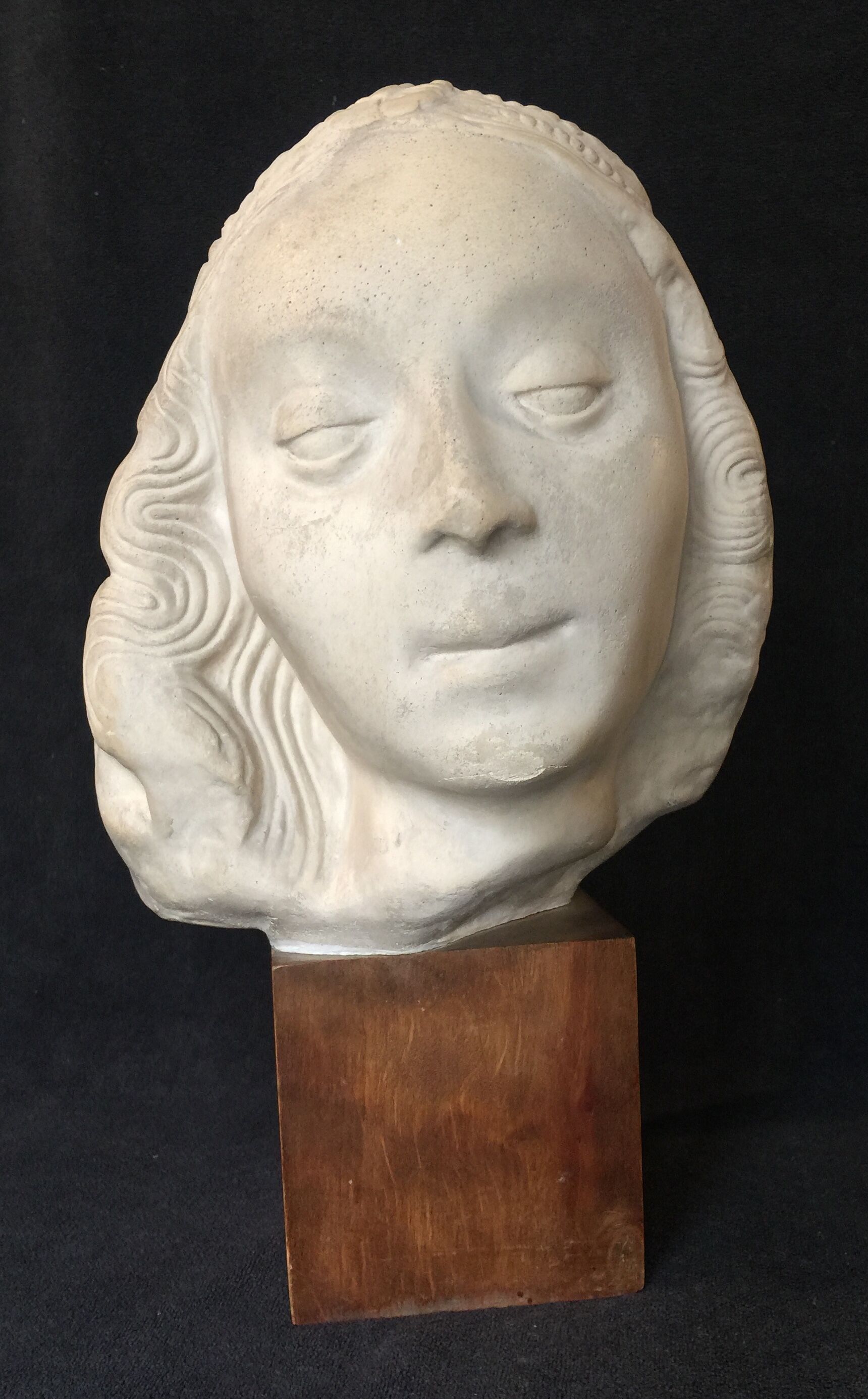 Bronze-middle-aged woman's head in plaster