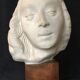 Bronze-middle-aged woman's head in plaster
