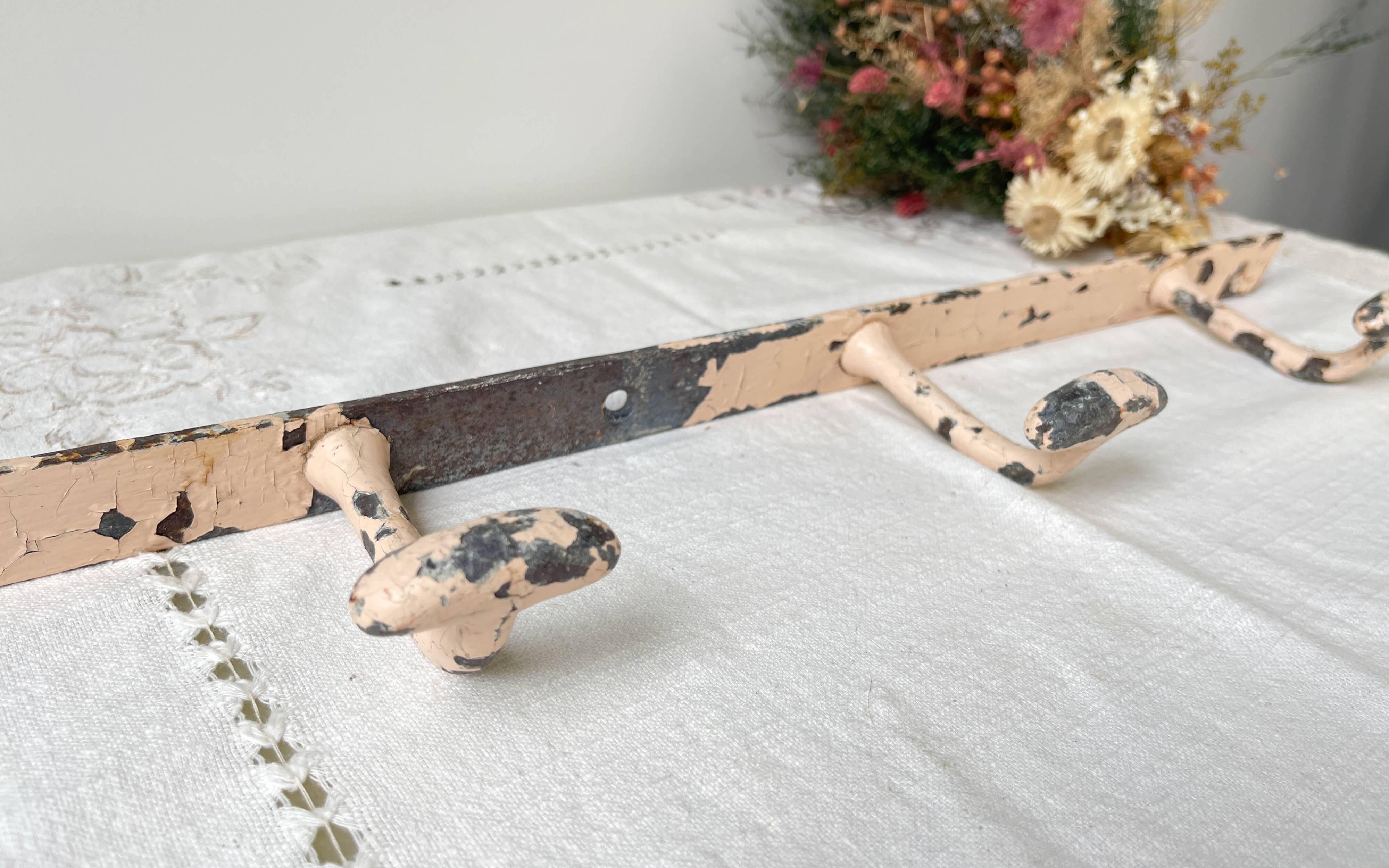 Vintage enameled cast iron wall hook with 3 hooks